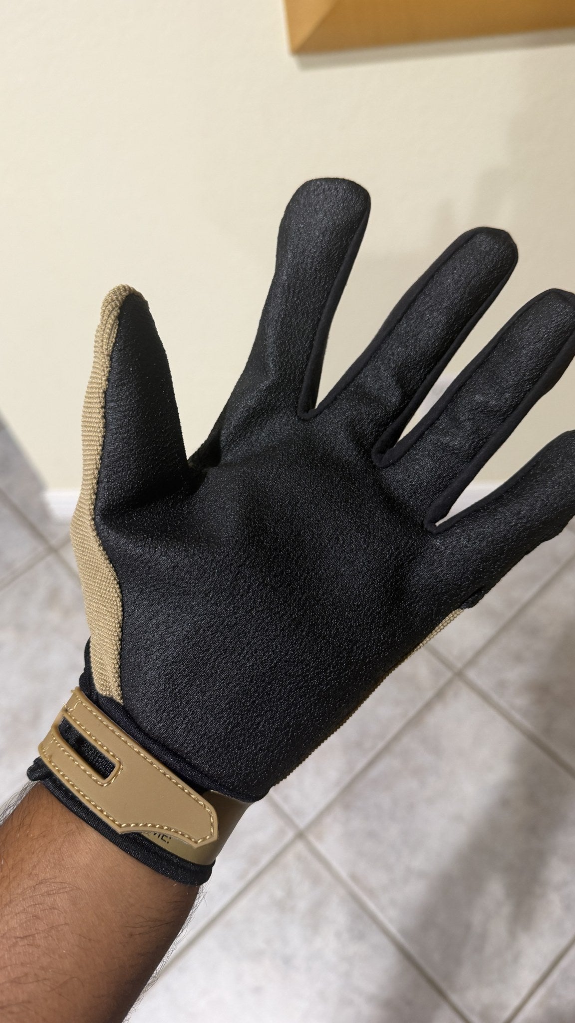 HexArmor ThornArmor 3092 cactus glove worn on hand, palm view showing the black TP-X grip palm and tan hook and loop cuff strap