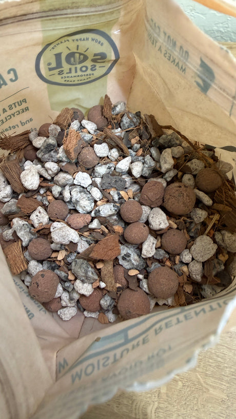 Open bag of cactus gritty mix showing pumice, granite, calcined clay and coconut husk chips