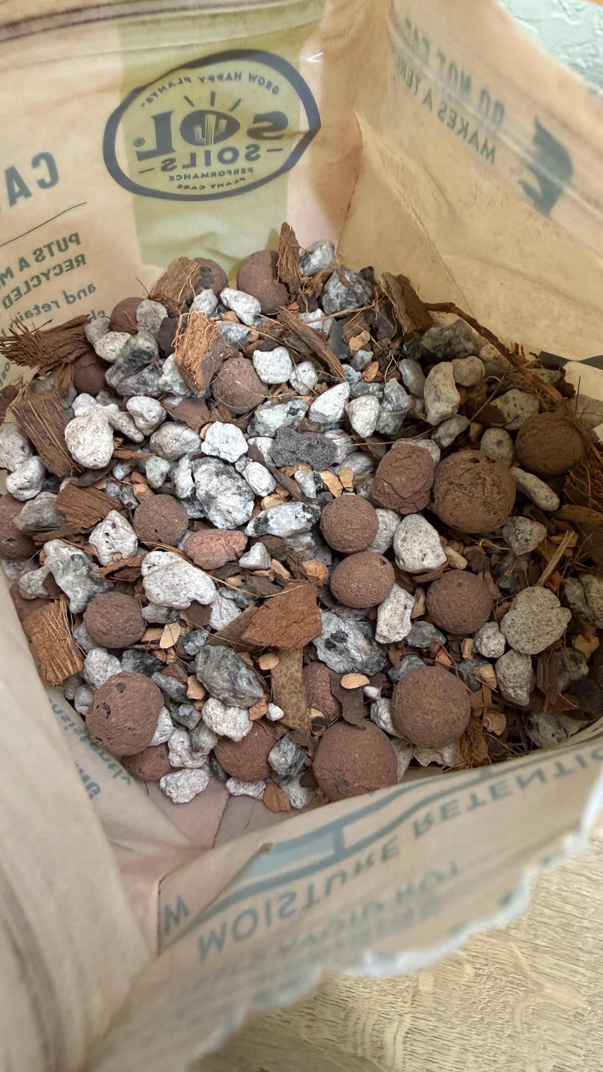 Close view of the chunky gritty mix components inside the open bag