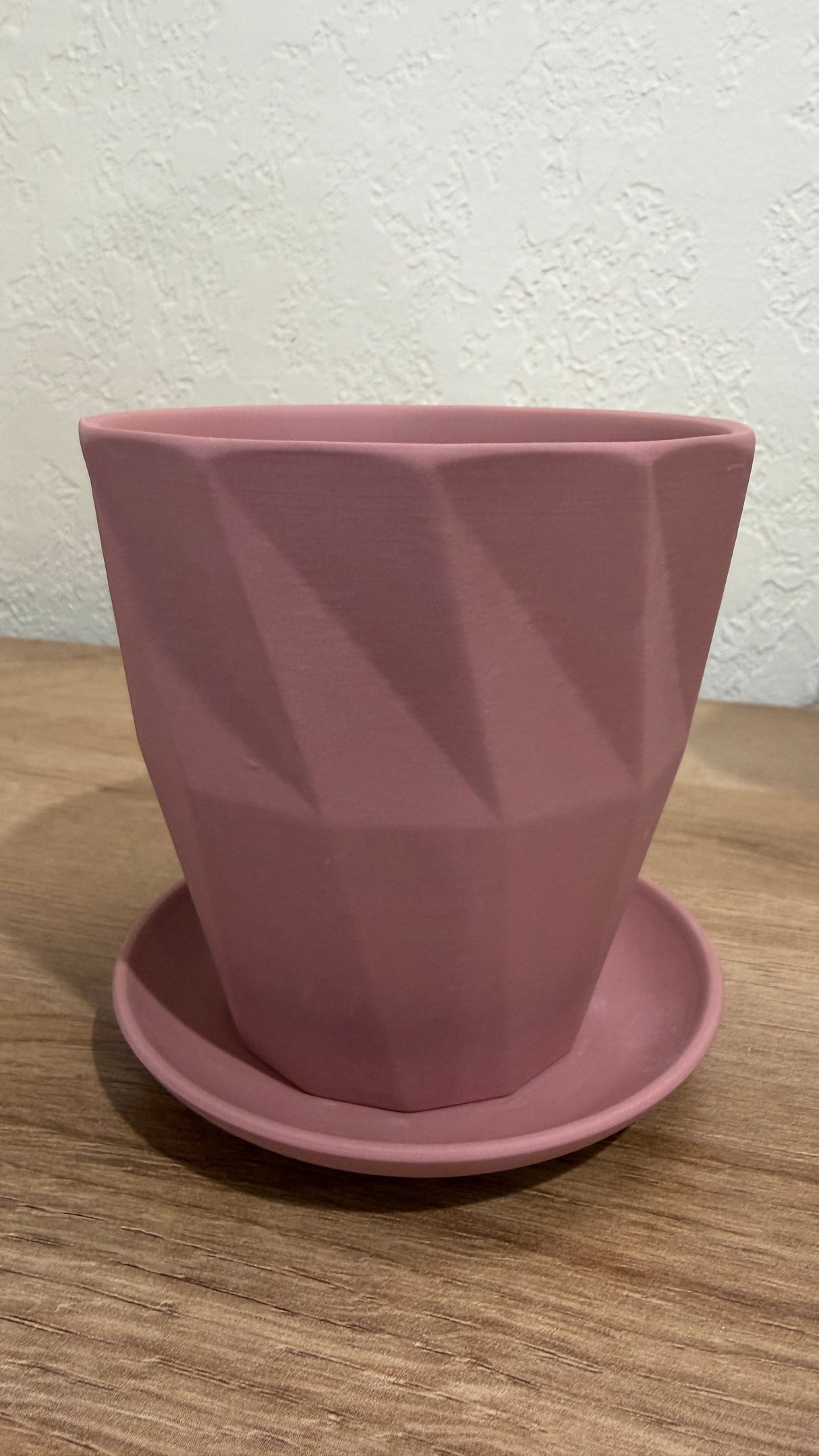 Faceted pink ceramic cactus and succulent pot with a matching saucer